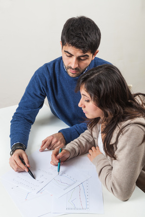 Young Woman Studying with Her Tutor